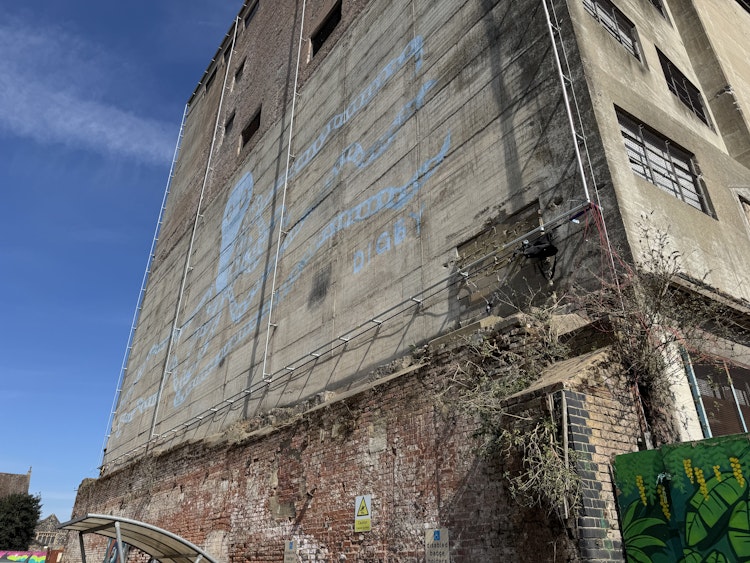 A giant frame was installed by commercial abseilers to hold the canvas in place
